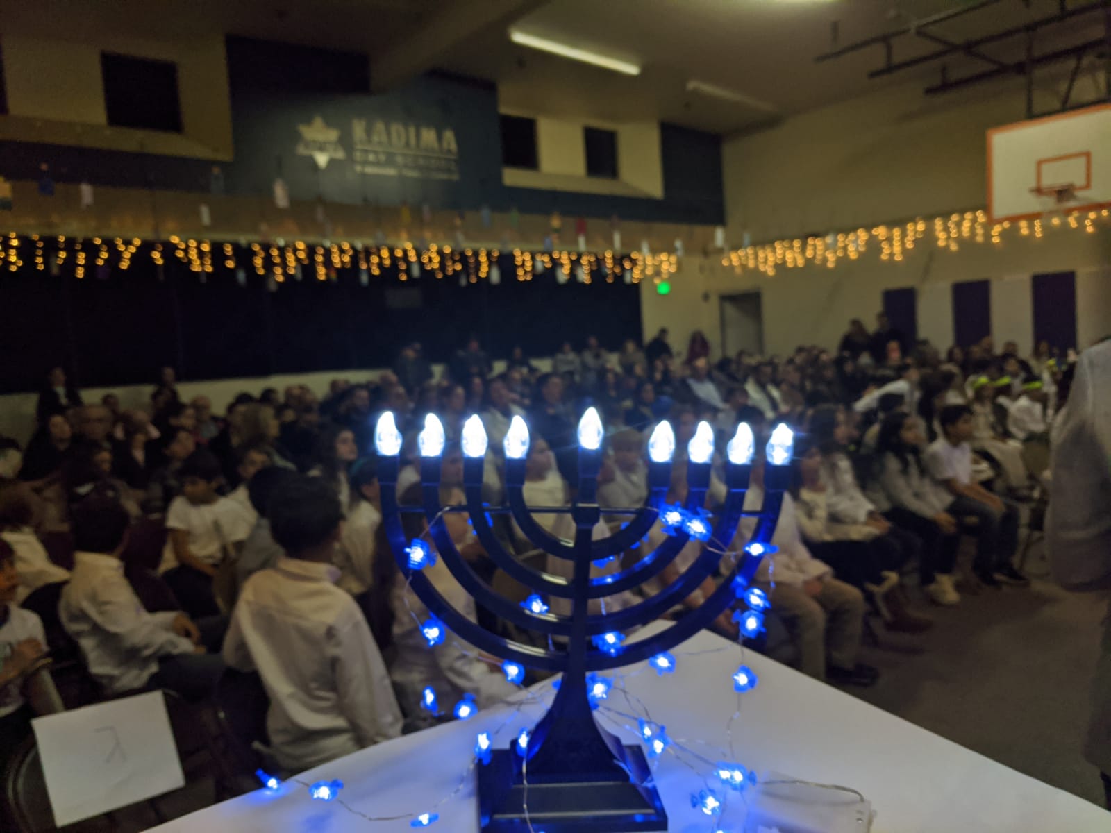 Black menorah with white and blue lights